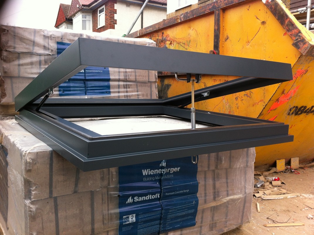 Opening flat roof skylight in anthracite grey installed in Richmond