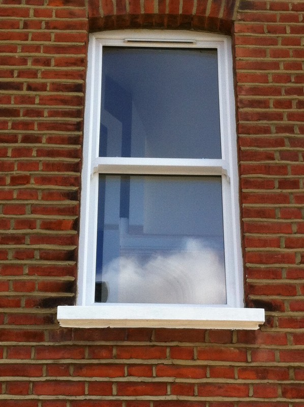 uPVC sash window on Victorian red brick house in Richmond